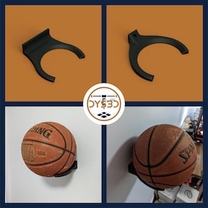 Op de afbeelding: Zwarte plastic basketbal wandbeugel met een basketbal eraan bevestigd. De basketbal is bruin en oranje met witte stiksels.