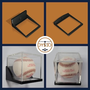 May include: Black wall mount display case for a baseball. The case is made of clear acrylic and has a black base. The baseball is a white Rawlings baseball with red stitching and the text "Official Ball 1994 World Series".