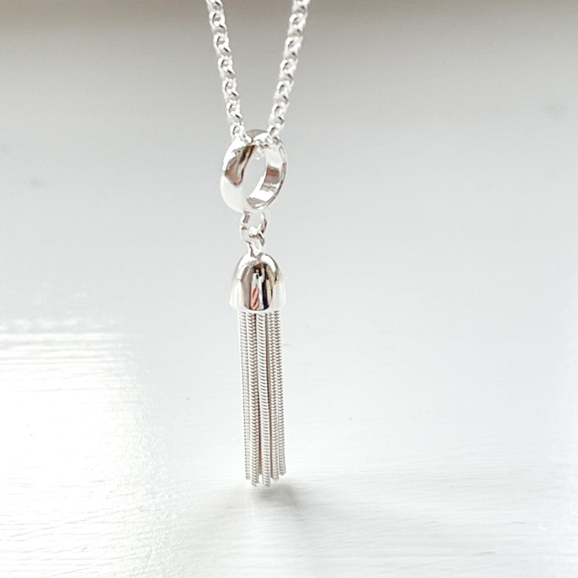 Sterling silver tassel best sale pendant