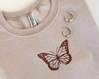 LADIES SWEATSHIRT,JUMPER,TOP WITH AN EMBROIDERED BUTTERFLIES DESIGN NAVY/GREEN LADIES SWEATSHIRT,JUMPER,TOP WITH AN EMBROIDERED BUTTERFLIES DESIGN NAVY/GREEN