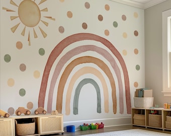 May include: A children's playroom with a large wall mural featuring a watercolor rainbow, sun, and polka dots in muted earth tones. The room has wooden toy storage, a woven rug, and a window.