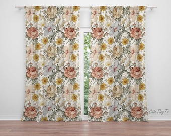 May include: A pair of white curtains with a floral pattern featuring pink, yellow, and green flowers. The curtains have a subtle sheen and are made of a lightweight fabric.