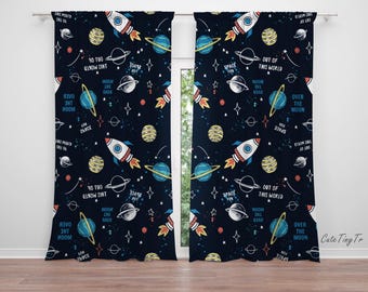May include: A pair of navy blue curtains with a space-themed pattern. The pattern features rockets, planets, stars, and the text "Space Fun", "Over the Moon", "Out of this World", and "To Two Worlds".