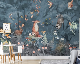 May include: A blue and green woodland mural featuring a fox, raccoon, rabbit, squirrel, and birds. The mural also features butterflies, flowers, and mushrooms. The text "Wild at Heart" is written on a small chalkboard.
