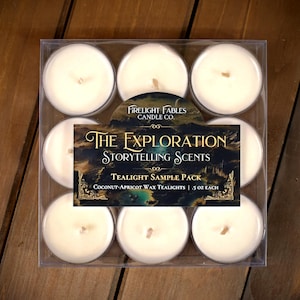 May include: A clear plastic container holding nine white tealight candles. The label reads "Firelight Fables Candle Co." and "The Exploration Storytelling Scents." The tealights are Coconut-Apricot wax, .5 oz each.