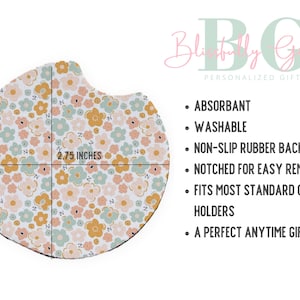 May include: A round coaster with a floral pattern in shades of pink, yellow, and green. The coaster is 2.75 inches in diameter and has a non-slip rubber backing. It is absorbent and washable.
