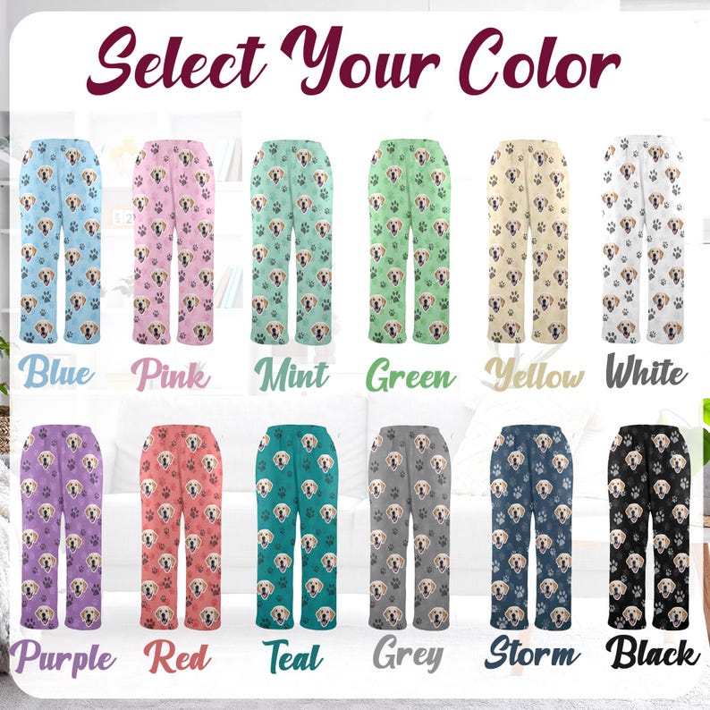 May include: A selection of pajama pants in various colors, each featuring a repeating pattern of a dog's face and paw prints. Colors include blue, pink, mint, green, yellow, white, purple, red, teal, grey, storm, and black. The text "Select Your Color" is at the top.