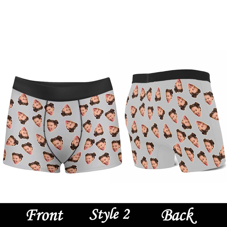 May include: Gray boxer shorts with a repeating pattern of a person's face. The front and back of the underwear are shown.