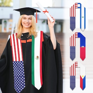 May include: Graduation sash with the American flag on one side and the Mexican flag on the other. The sash is white with red and green stripes. The sash is worn by a person in a graduation gown.