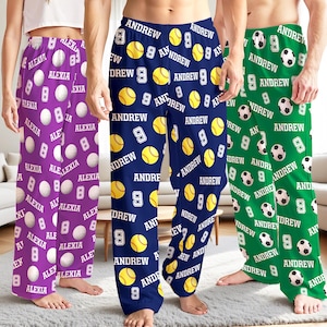 May include: Three pairs of pajama pants with personalized designs. One pair is purple with "ALEXIA" and white baseballs. The second pair is navy blue with "ANDREW" and yellow tennis balls. The third pair is green with "ANDREW" and white soccer balls.