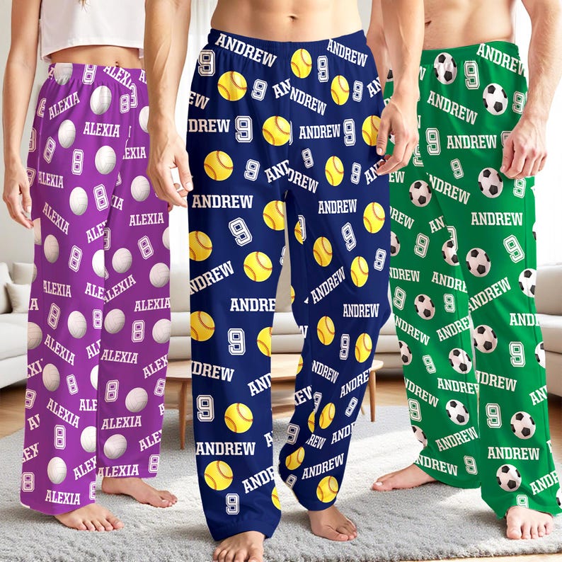 May include: Three pairs of pajama pants with personalized designs. One pair is purple with "ALEXIA" and white baseballs. The second pair is navy blue with "ANDREW" and yellow tennis balls. The third pair is green with "ANDREW" and white soccer balls.
