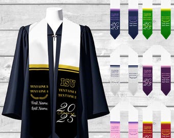 May include: A white graduation stole with black trim and gold accents. The stole has the text "ISU" and "TEXT LINE 1" and "TEXT LINE 2" in black. The stole also has the text "TEXT LINE 3" and "TEXT LINE 4" in gold. The stole has the year "2025" in white. The stole is shown on a model wearing a black graduation gown.