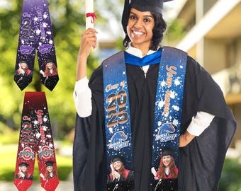 May include: Two graduation sashes with a white background and blue and orange accents. The sashes have the text "Your Name" and "Class of 2025" printed on them. The sashes are worn by a person in a graduation cap and gown.
