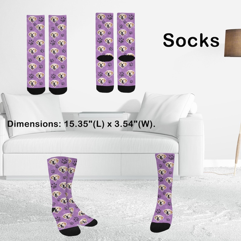 May include: A pair of socks with a purple background, featuring a pattern of golden retriever faces and paw prints. The word "Socks" is displayed in black. Dimensions: 15.35 inches (L) x 3.54 inches (W).