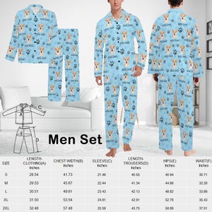 May include: A men's pajama set with a light blue background and a pattern of white paw prints and a dog's face. The set includes a long-sleeved shirt and pants. The shirt has a button-up collar and the pants have an elastic waistband. The size chart is included in the image.
