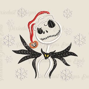 May include: White and black embroidered design of Jack Skellington from The Nightmare Before Christmas wearing a Santa hat. The design is surrounded by snowflakes.