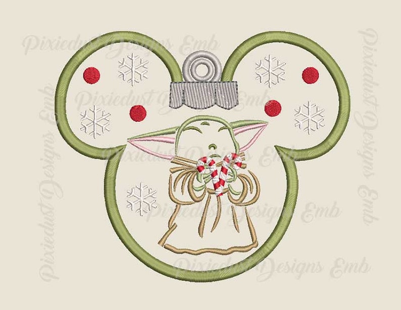 May include: Green Christmas bauble shaped like Mickey Mouse ears with a small green alien character holding candy canes in the centre. The bauble has red and white snowflakes and red dots around the edges.