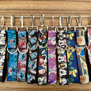 Disney Keychains!  Wrist strap, click n go, CNG, key ring.  Stitch, Pluto, Tinker Bell, Mickey Mouse, Beauty Beast, Snow White, Fab 5
