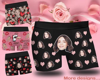 May include: Three pairs of black and white boxer shorts with a variety of colorful designs. The designs include hearts, lips, and faces. The text "Only girls can turn me on" is printed on one pair of boxers.