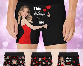 May include: Black boxer briefs featuring a graphic of a person in a red dress with the text "This belongs to me" and red hearts. Additional variations show repeating patterns of faces and hearts, or a person in a red dress with "Your text".