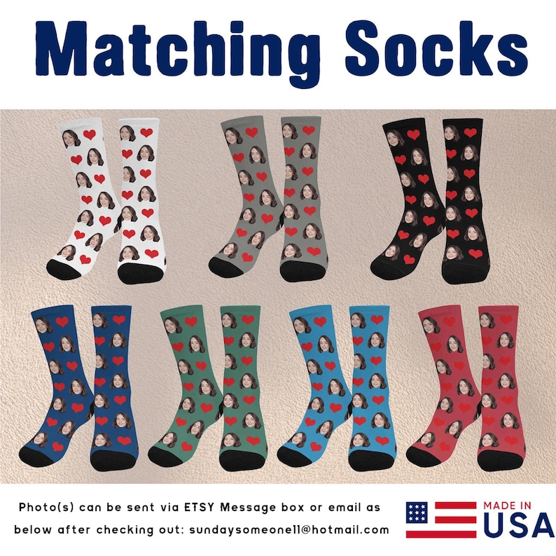 May include: Six pairs of colorful socks with a heart pattern and a face printed on them. The socks are arranged in two rows of three pairs. The socks are made in the USA.