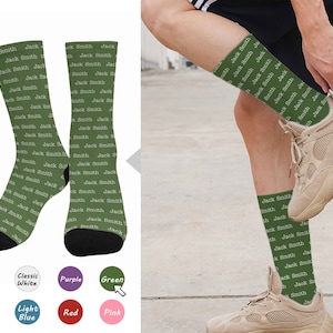 May include: A pair of green socks with a white repeated pattern of "Jack Smith" on them. The socks are shown on a person's feet. The socks are available in a variety of colors.
