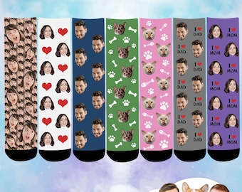 May include: Six pairs of colorful socks with different patterns. The socks feature a repeated pattern of faces, hearts, paw prints, bones, fish bones, and the text "I love Dad" and "I love Mom".
