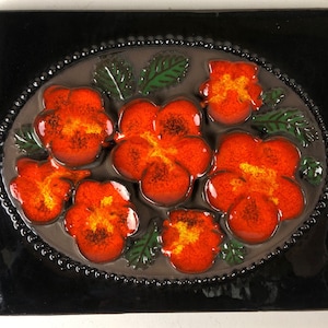 Jie Gantofta ceramic wall plaque with an orange with yellow flower motif, design Aimo Nietosvuori Sweden 1960s