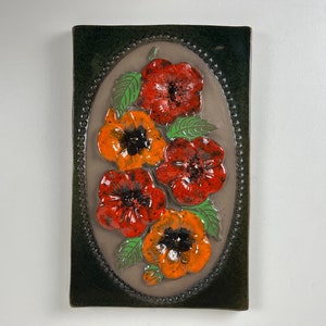 Large Jie Gantofta ceramic wall plaque with a red and orange flower motif, design Aimo Nietosvuori Sweden 1960s