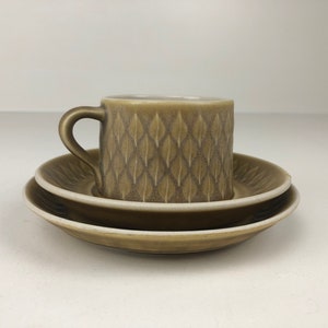Beautiful Jens Quistgaard Relief tea cup, saucer and plate. Mid Century Modern design.