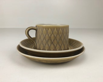 Beautiful Jens Quistgaard Relief tea cup, saucer and plate. Mid Century Modern design.