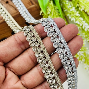 May include: A set of three ceramic mugs with a speckled, matte finish. The mugs are in shades of cream, light gray, and dark gray. Each mug has a simple, minimalist design, perfect for coffee or tea.