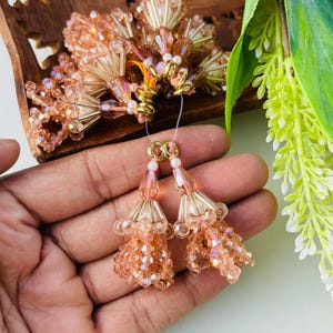 Crystal Beaded Latkan Tassel Set: Rose Gold Lehenga, Blouse, Dupatta Décor