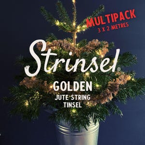 May include: A small artificial Christmas tree decorated with golden jute string tinsel. The tree is in a metal bucket and has white lights. The text "MULTIPAC 3 X 2 METRES" and "Strinsel GOLDEN JUTE STRING TINSEL" is visible on the image.