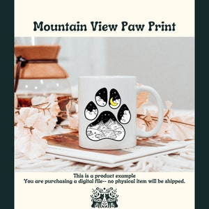 May include: White ceramic mug with a black and white paw print design. The paw print features a mountain range, a lake, a crescent moon, and stars. The text "Mountain View Paw Print" is at the top of the image.