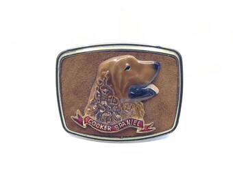 1979 Raintree metal and suede belt buckle with cocker spaniel motif made in USA