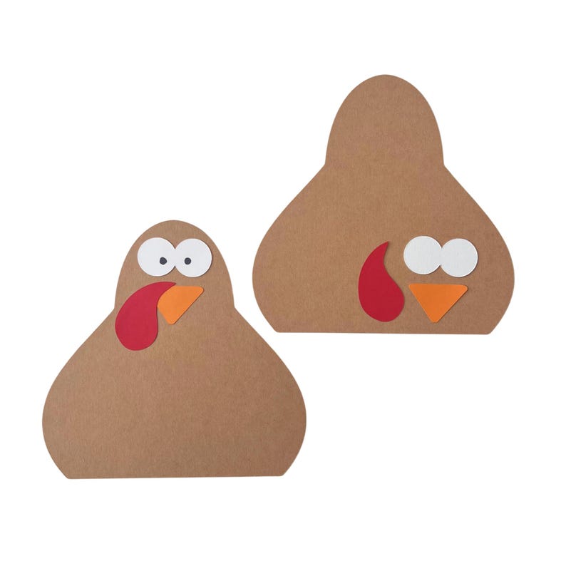 Puede incluir: Dos recortes con forma de pavo hechos de cartulina marr&oacute;n. Cada recorte presenta dos ojos circulares blancos con pupilas negras, un peque&ntilde;o pico triangular naranja y una car&uacute;ncula roja en forma de l&aacute;grima sobre el cuerpo marr&oacute;n.