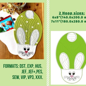 May include: Green and white embroidered bunny rabbit design for a 6x8 inch or 7x11 inch embroidery hoop. The design includes a bunny face with pink nose and whiskers. The design is available in the following formats: DST, EXP, HUS, JEF, JEF+, PES, SEW, VIP, VP3, XXX.