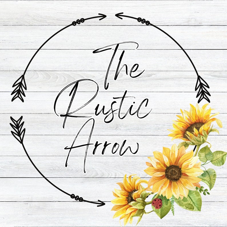May include: A rustic wood background with a black circle and arrows. The text "The Rustic Arrow" is written in black cursive inside the circle.  Three yellow sunflowers with green leaves are arranged around the circle.