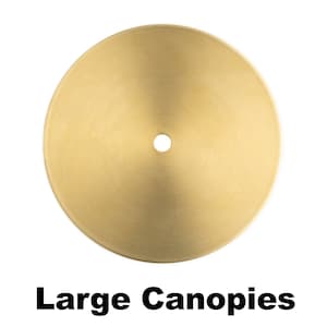 May include: A large, round, gold-colored metal canopy for a light fixture.