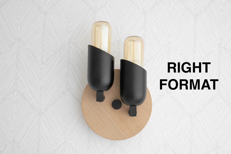 May include: A pair of black wall sconces with wood bases and clear glass bulbs. The sconces are mounted on a white wall with a geometric pattern.