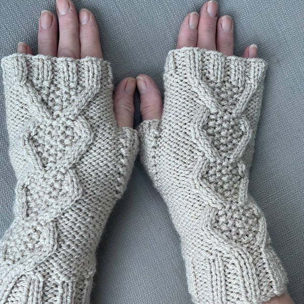 Women's cable pattern fingerless gloves/wrist warmers in cream/stone.