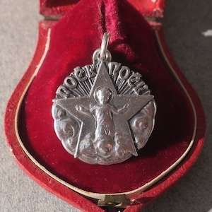 MELLERIO dits MELLER Rare Christmas medal pendant Jesus Star solid silver French vintage 1920s