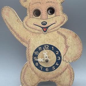 May include: A set of three ceramic mugs with a speckled, matte finish. The mugs are in shades of cream, light gray, and dark gray. Each mug has a simple, minimalist design and a rounded handle.