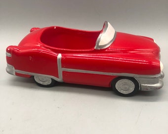 Vintage red ceramic classic car decor.