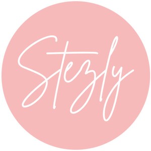May include: A pink circle with the word "Stezly" written in white cursive script.