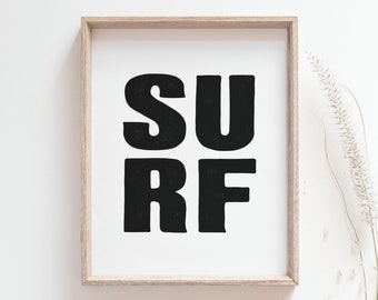 May include: A framed print with the word "SURF" in bold, black letters on a white background.