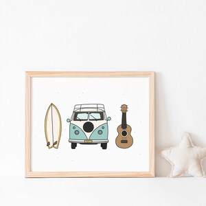 May include: A framed print with a blue and white vintage van, a surfboard, and a brown ukulele. The print is on a white background and is framed in a light wood frame.