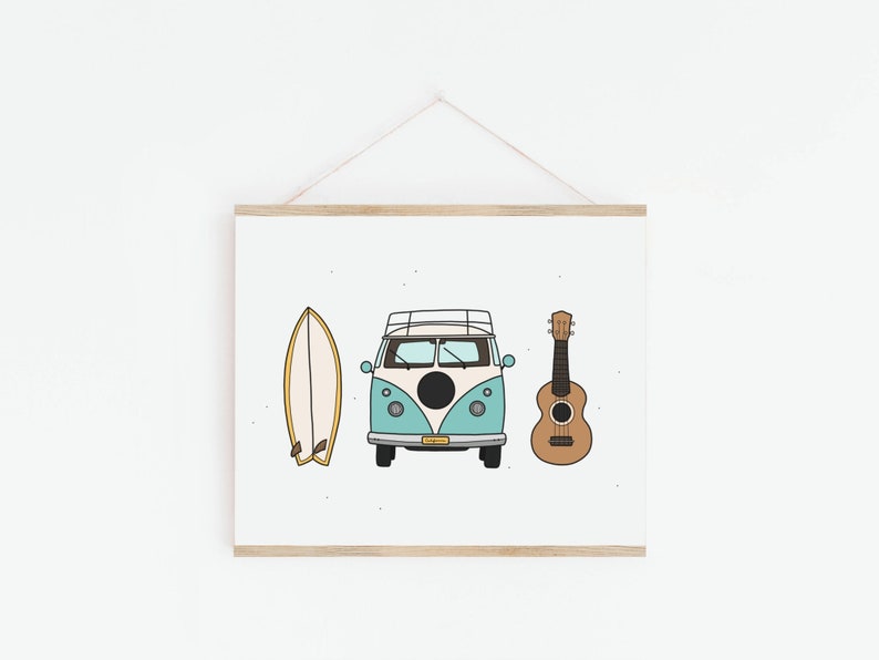 May include: A framed print featuring a blue and white vintage van, a surfboard, and a ukulele. The van has a black circle on the side and a surfboard is on the roof. The print has a white background with a subtle speckled pattern.