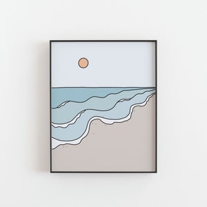 May include: A framed illustration of a beach scene with blue waves crashing on a sandy shore. The sun is a peach color in the sky.